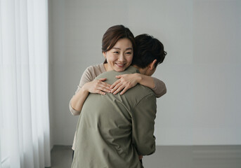 Woman embracing man affectionately in a modern indoor setting  