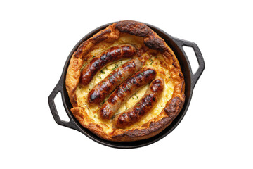 top view of traditional English toad in the hole with sausages and cheese, in a cast iron pan, isolated on a white background
