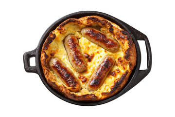 top view of traditional English toad in the hole with sausages and cheese, in a cast iron pan, isolated on a white background