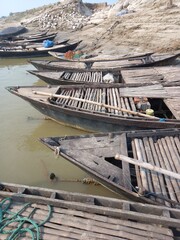 Close-up of traditional wooden boats with oars and fishing nets