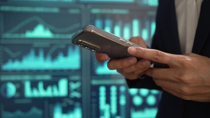 Professional individual woman in navy suit uses smartphone while standing, glowing digital dashboards, data analytics, futuristic interface elements, advanced technology for business intelligence. - Powered by Adobe