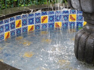 fountain in the park in Michoacan, Mexico with colorful traditional handmade tiles-talavera with monarch butterflies