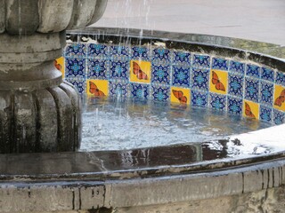 fountain in the park in Michoacan, Mexico with colorful traditional handmade tiles-talavera with monarch butterflies