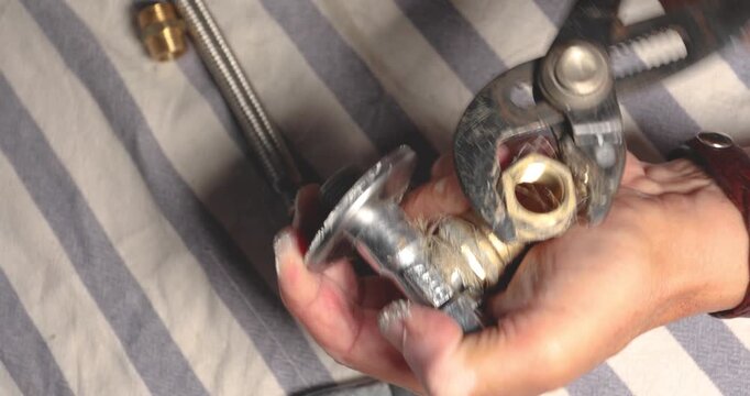 Tightening metal plumbing fitting with wrench