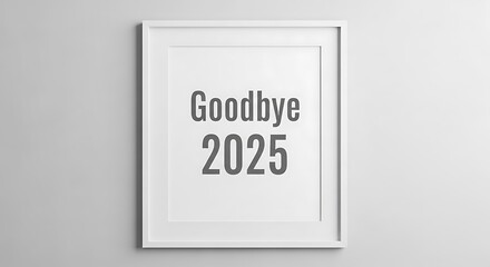 Framed goodbye 2025 print hanging on a gray wall space