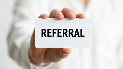 Hand holding referral card promotion business marketing strategy networking partnership success collaboration customer