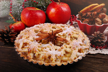 Homemade apple pie for Christmas on wooden table