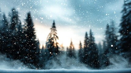 Snowflakes forming on window glass Wintery landscape through a raindrop-covered window with evergreen trees in the background.