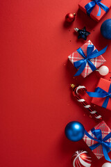 Colorful vertical presents with blue ribbons and shiny ornaments on a bold red backdrop evoke...