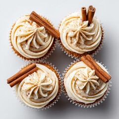 Traditional decorated Christmas cupcakes holiday baking Delicious cupcakes topped with creamy frosting and cinnamon sticks, arranged in a delightful presentation.