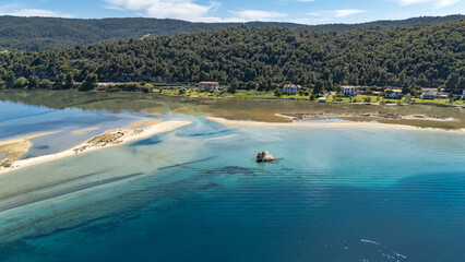 Aerial drone view of Fteroti Beach, sandbanks and lagoon in Sithonia, Chalkidiki, Greece