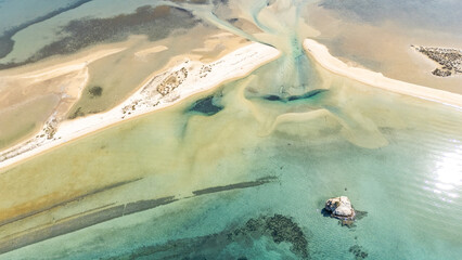 Aerial drone view of Fteroti Beach, sandbanks and lagoon in Sithonia, Chalkidiki, Greece