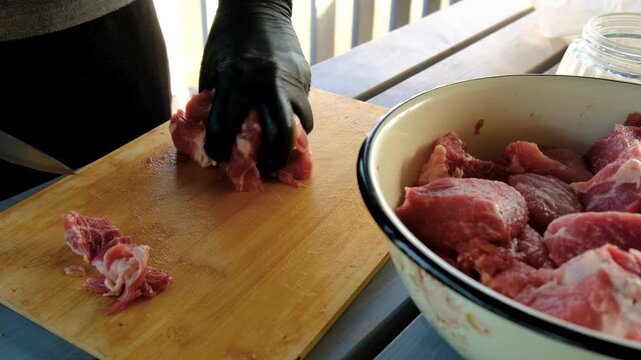 A man cutting meat. Selective focus.
