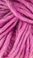Pink wool yarn texture, close up of soft chunky knitting material