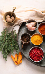 Different aromatic spices in bowls.