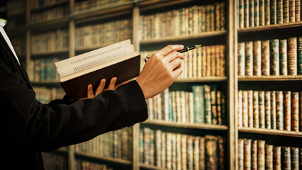 Professional woman reading open book inside library, information management, cataloging, knowledge organization, user guidance, literacy promotion, the expanding role of modern librarians in digital.