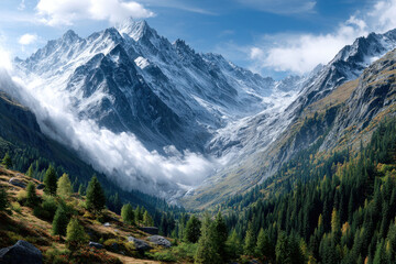 Fototapeta premium Snowy Alpine peaks above a misty valley and autumn forest
