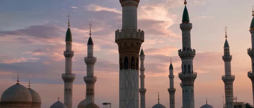 Majestic Minarets of the Prophets Mosque in Medina at Sunset.