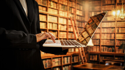 Professional woman using laptop inside library, digital resource organization, user assistance, literacy development, essential role librarians play in modern knowledge and data environments.