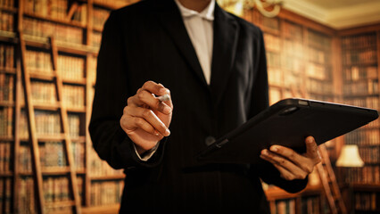 Professional woman holding digital tablet inside library, representing information management,...