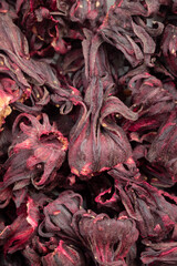 Pile of dried Roselle calyxes for background. Top view