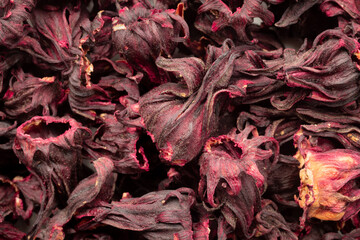 Pile of dried Roselle calyxes for background. Top view