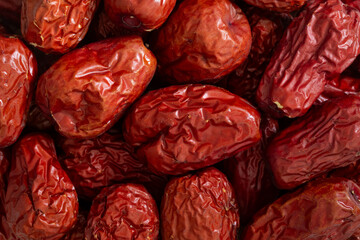 Pile of dried Chinese jujube fruit (red dates) for background. Close-up