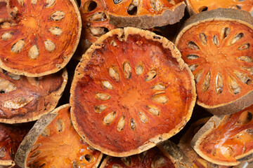Pile of dried Bael fruit slices for background. Top view