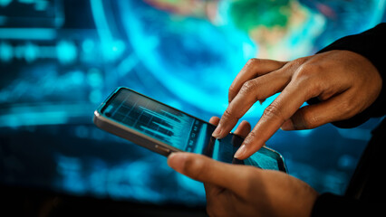 Business woman holding smartphone in front of futuristic digital interface, global communication, technology networking, data connectivity, mobile interaction, high-tech environment.