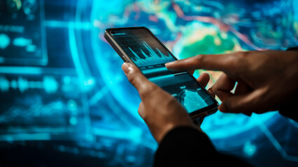 Business woman holding smartphone in front of futuristic digital interface, global communication, technology networking, data connectivity, mobile interaction, high-tech environment.