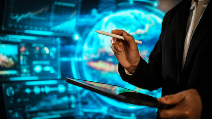 Business woman using tablet in front of a futuristic digital interface, representing data analysis, global technology, virtual communication, innovation, modern workflow in high-tech environment.