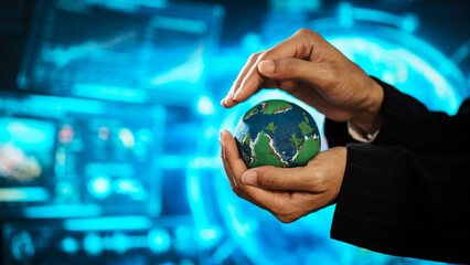 Business professional holding small Earth model before futuristic digital interface, global responsibility,environmental awareness,world protection, sustainability, modern international collaboration