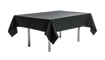 A rectangular table covered in a sleek, black tablecloth with metal legs, isolated on black