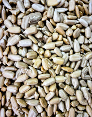 Close up sunflower seeds surface showing organic plant food texture background