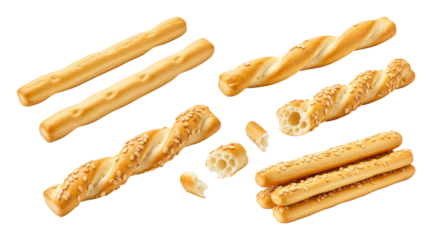 Golden twisted and straight sesame breadsticks (grissini) arranged on transparent background, some stacked and one broken to show airy interior