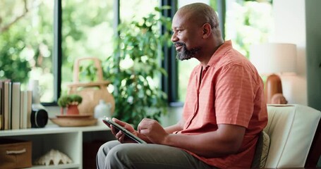 Home, tablet and black man on sofa, smile and typing with social media, internet and streaming service. Apartment, tech and mature person on couch, network and connection with subscription and email - Powered by Adobe