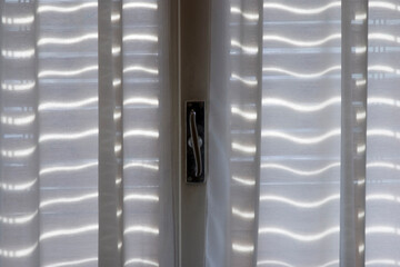 wavy curtain in a window