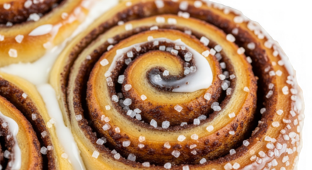 Cinnamon Roll Delight: A close-up view unveils a delicious cinnamon roll, with its warm, inviting spiral layers and a generous drizzle of sweet icing.
