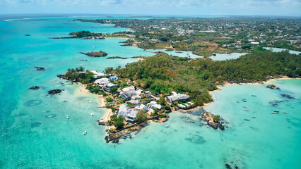 A stunning aerial view of the Mauritius landscape featuring panoramic perspectives of crystal-clear turquoise waters, tropical coastline, and lush island scenery