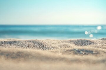 Soft sunlit beach sand with gentle ocean blur and bright coastal reflections, ideal for summer travel themes, clean branding layouts, lifestyle visuals, and peaceful background designs