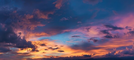 Fototapeta premium Colorful sunset sky with dramatic clouds and soft glowing light in vibrant tones, ideal for backgrounds, digital art, travel visuals, and atmospheric presentation scenes