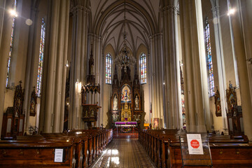 Fototapeta premium Novi Sad, Serbia - Decmber 09, 2025: Interior of the Catholic Cathedral of the virgin Mary at the Central square of the city Novi Sad in Serbia.