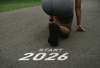 Happy new year 2026, Athlete Preparing for a New Beginning in 2026 on an Outdoor Track with Innovative Fitness Ideas and Goals for a Healthier Lifestyle