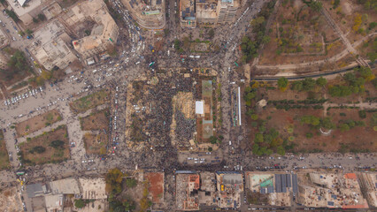 Aerial shot captures Syrians celebrating the first anniversary of the end of the war.