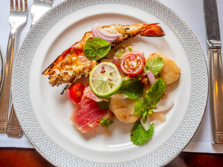 Grilled prawn and tuna served in chilli Thai style sauce in luxury restaurant