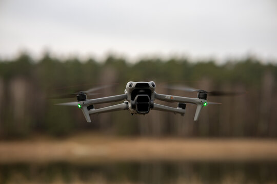 Poznan, Poland, 10 December 2025: DJI Air 3s drone in flight. Selective focus 