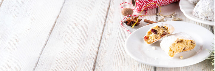 Homemade Christmas stollen bites, miniature, bite-sized versions of traditional Christmas fruit cake bread, chocolate and vanilla stollen cookies biscuits with dried fruits, nuts, marzipan, spices