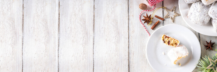Homemade Christmas stollen bites, miniature, bite-sized versions of traditional Christmas fruit cake bread, chocolate and vanilla stollen cookies biscuits with dried fruits, nuts, marzipan, spices