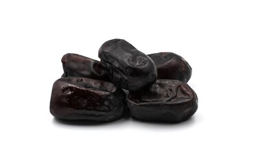 Pile of dried dates on white background