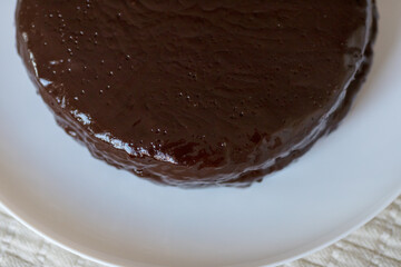 Chocolate cake Prague on the white background. Traditional Sacher cake. Ready to eat.
